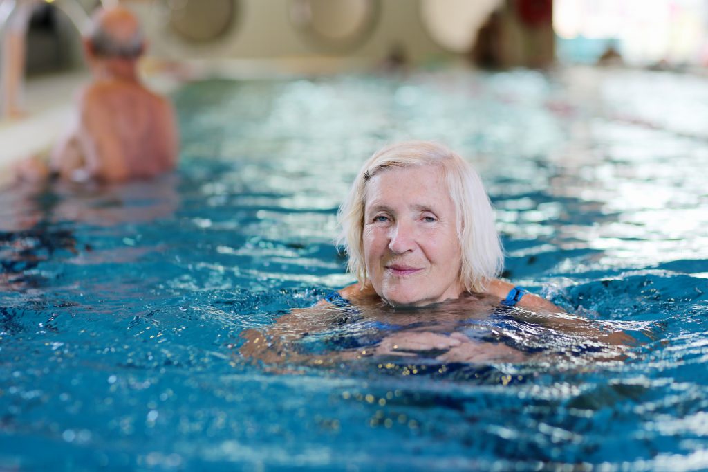 old lady in swimming pool looking at the camera