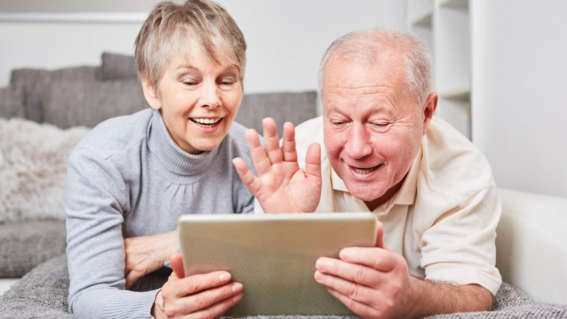 keeping in touch with elderly relatives during lockdown - elderly couple on a video call to family