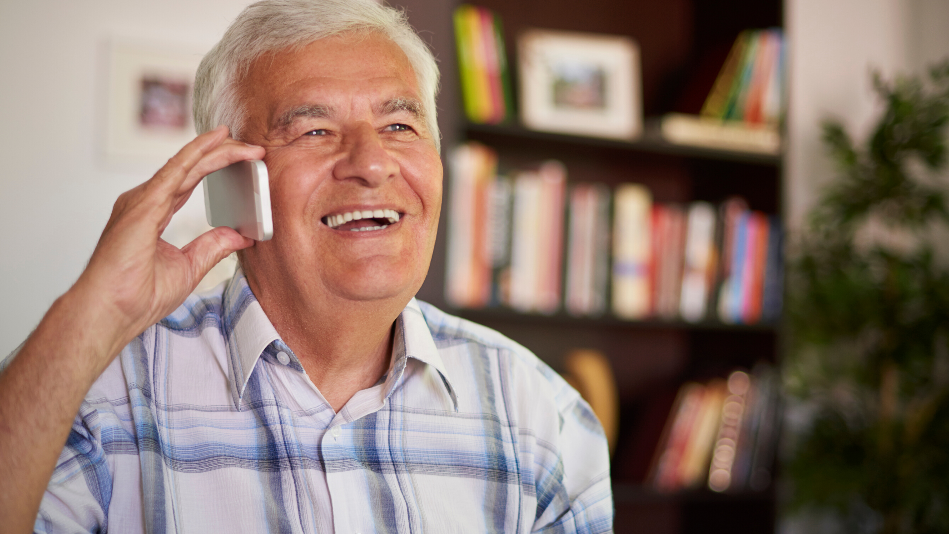 elderly man talking on telephone