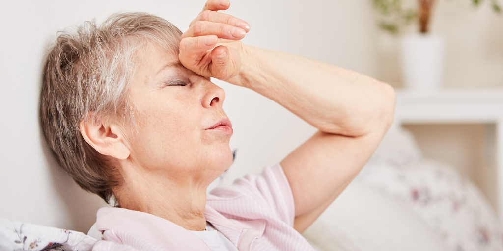 benefits of drinking water hydration in older adults lady sat down feeling faint