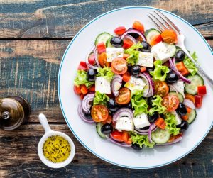 Delicious Summer Meal Ideas greek salad with a side serving of herb olive oil