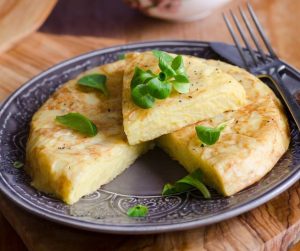 Delicious Summer Meal Ideas spanish omelette with herb garnish