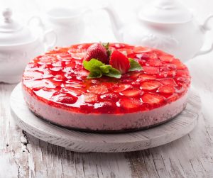 Delicious Summer Meal Ideas strawberry cheesecake with strawberries on top